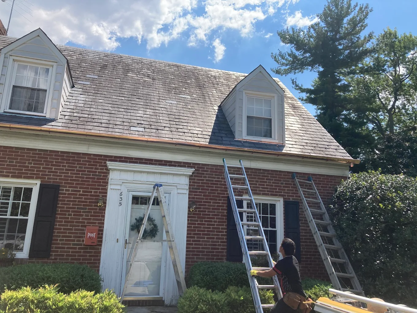 Cedar shake roof with new copper drip edge on a brick colonial home
